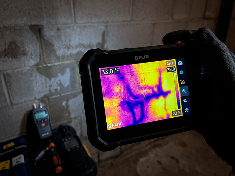 Technician measuring sub-slab moisture